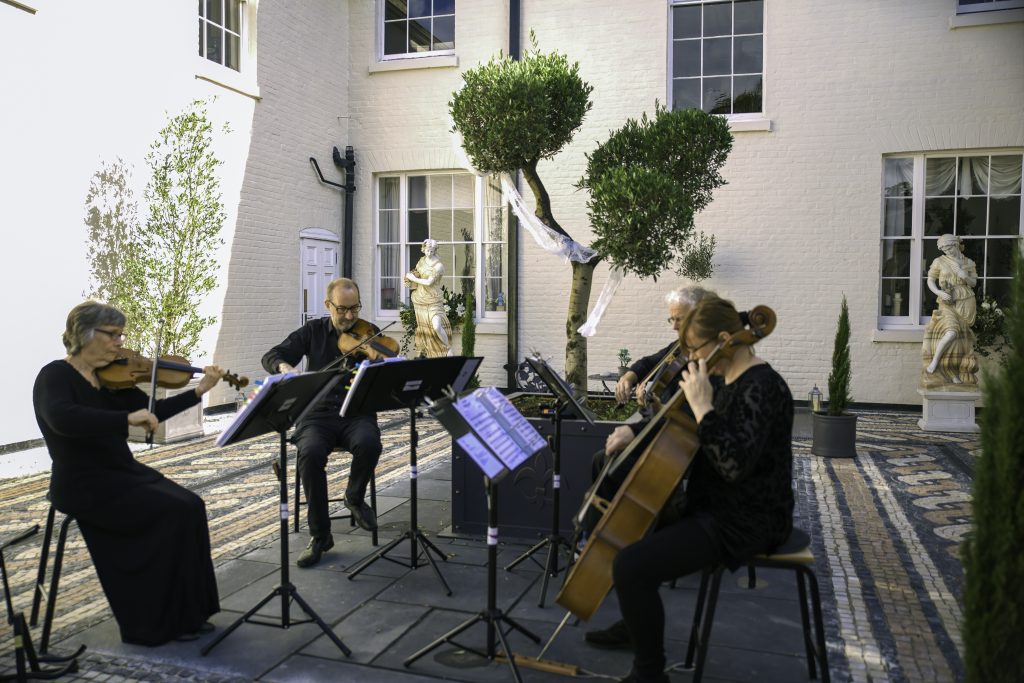string quartet playing at aternoon reception