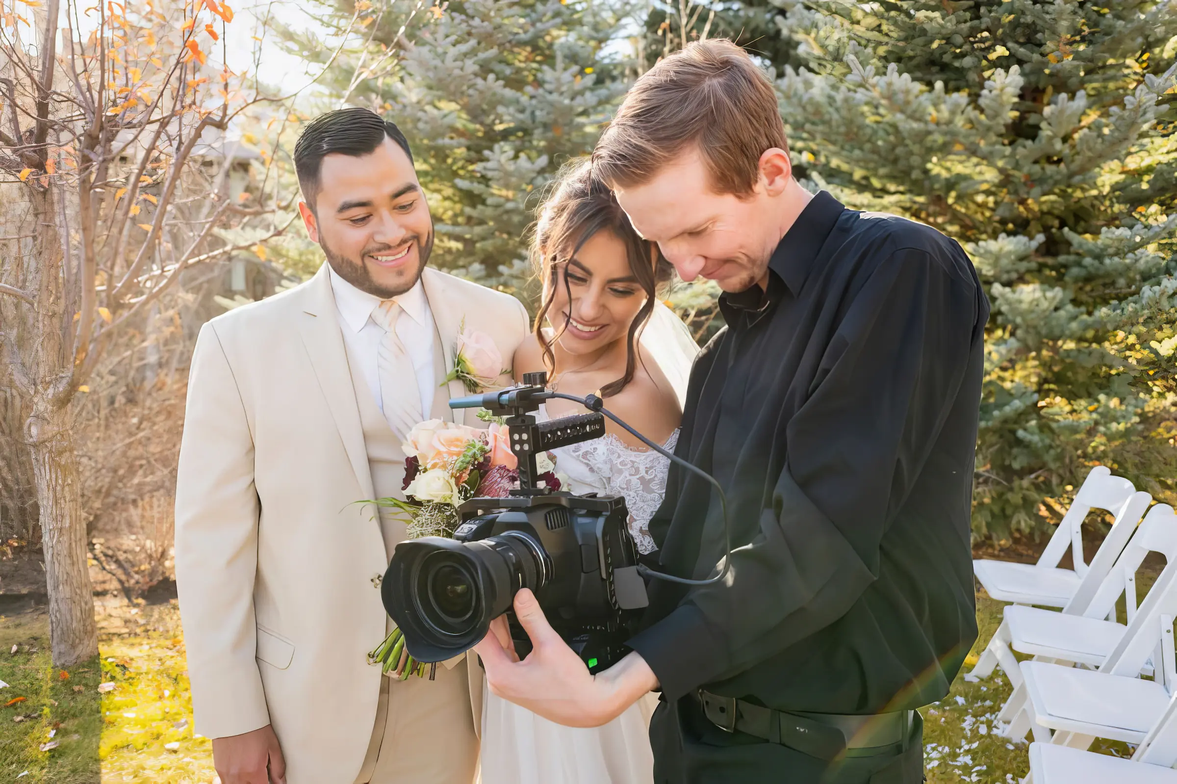 Norfolk Wedding Videographer - Bride & Groom Checking Videographer Footage