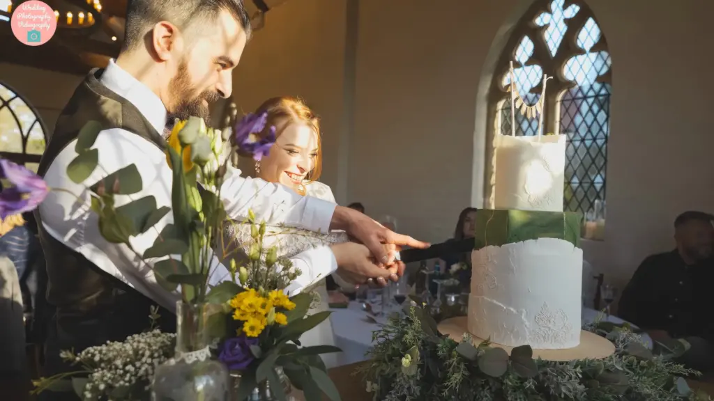 Bride & Groom Cutting The Cake