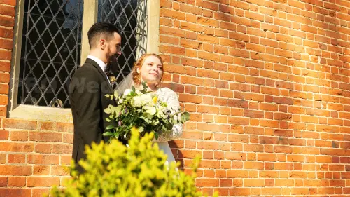 groom bride smile wall